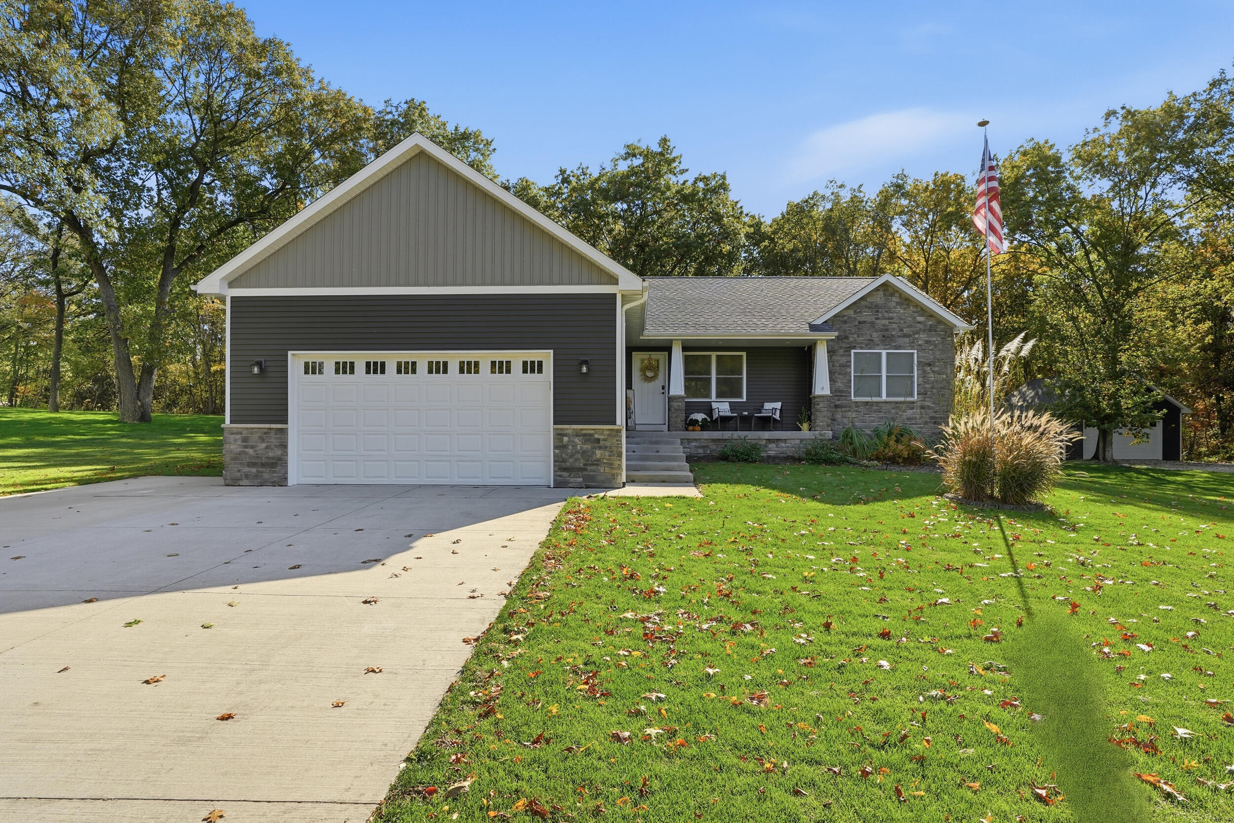 10385 Lakota Court Demotte, IN 46310 - Photo 2 of 29 a front view of a house with garden