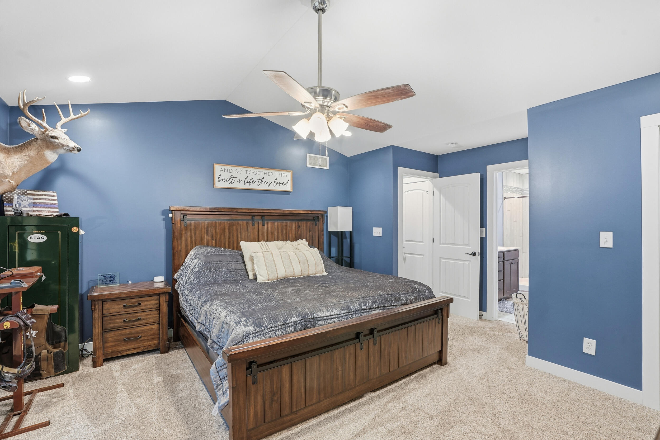 10385 Lakota Court Demotte, IN 46310 - Photo 24 of 29 a living room with a bed and a chandelier