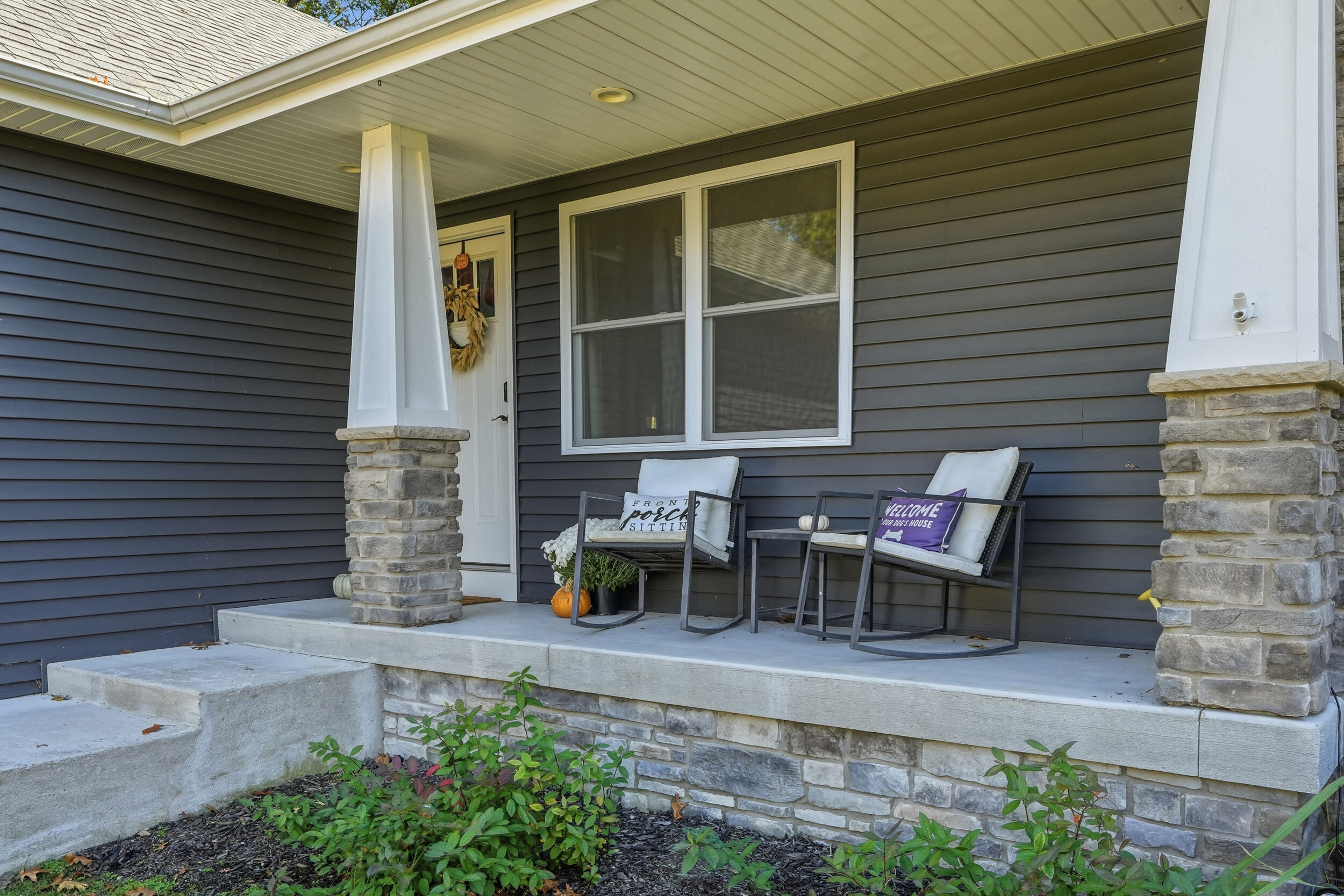 10385 Lakota Court Demotte, IN 46310 - Photo 3 of 29 a view of a patio with table and chairs and potted plants