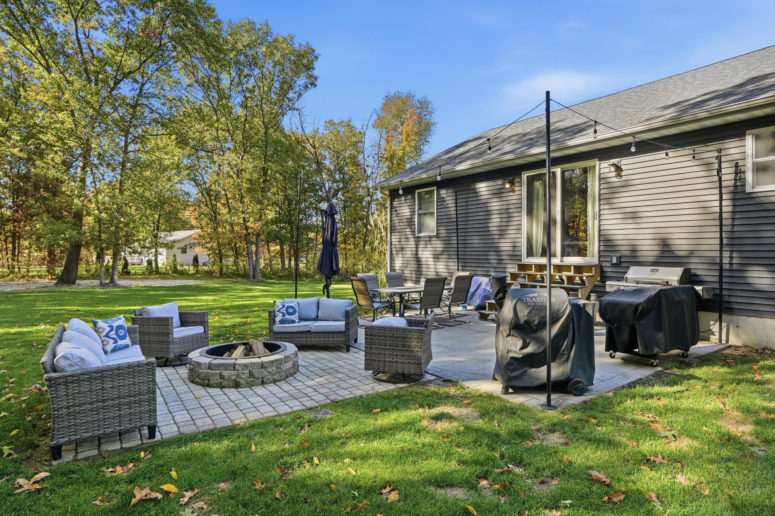 10385 Lakota Court Demotte, IN 46310 - Photo 5 of 29 a view of a patio with couches chairs and a yard