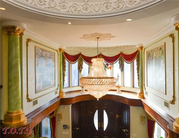 a bedroom with a bed and dresser with mirror