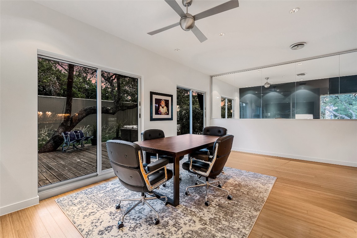 2606 Ranch Road 620 North Austin, TX 78734 - Photo 14 of 28 a view of a dining room with furniture and wooden floor