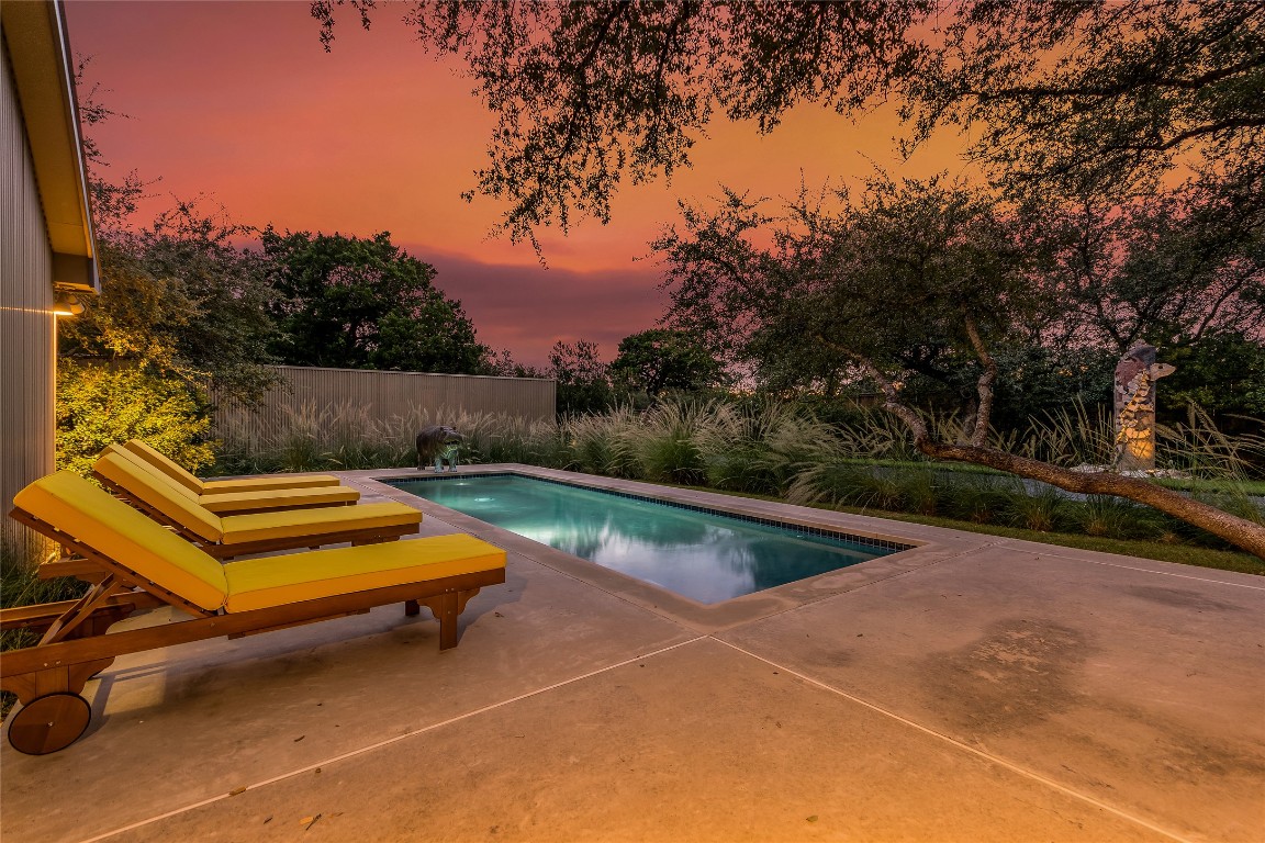 2606 Ranch Road 620 North Austin, TX 78734 - Photo 21 of 28 a view of a swimming pool with a lounge chairs