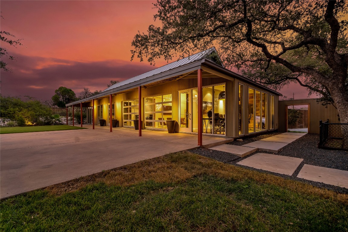 2606 Ranch Road 620 North Austin, TX 78734 - Photo 4 of 28 a view of an house with backyard and a tree