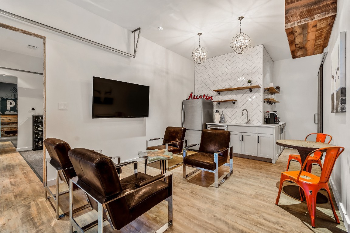 2606 Ranch Road 620 North Austin, TX 78734 - Photo 6 of 28 a living room with furniture and a flat screen tv
