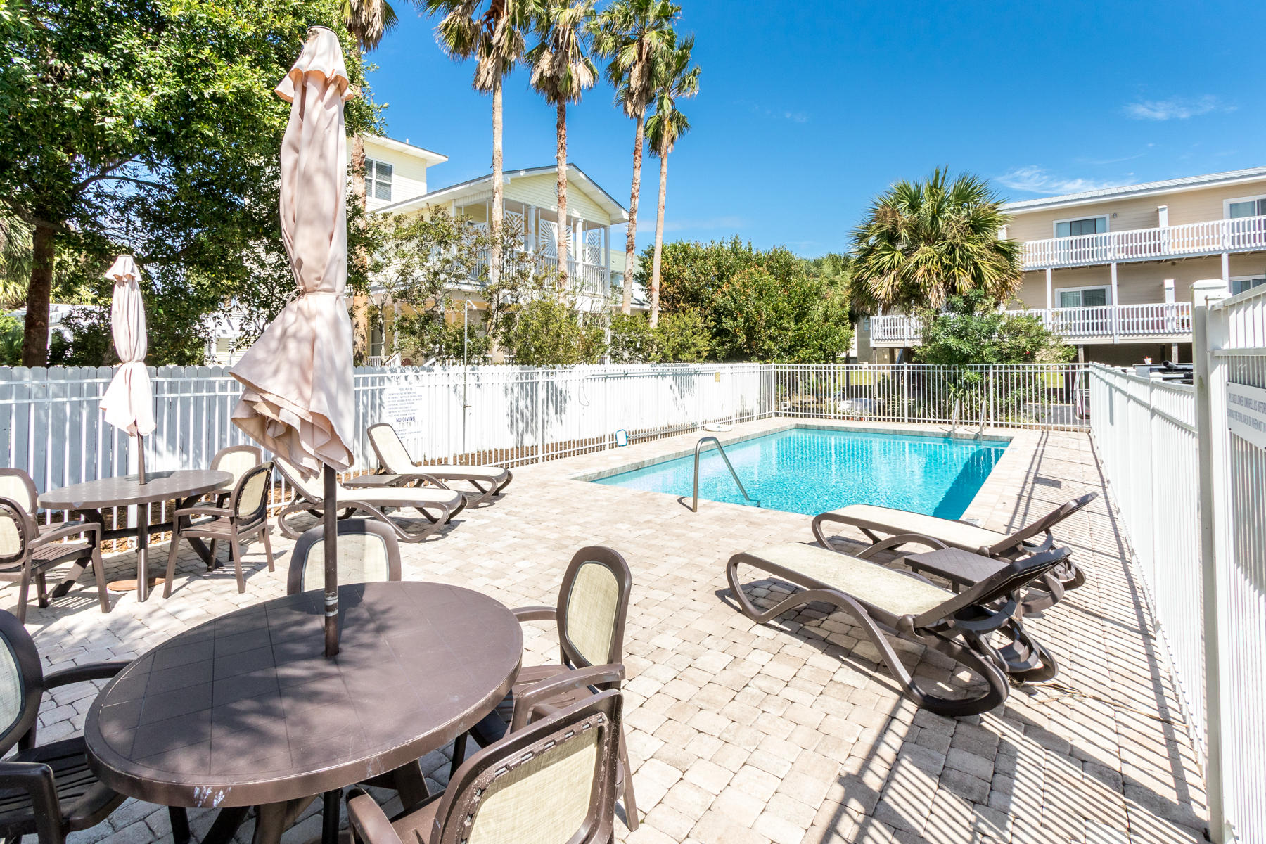 191 Blue Mountain Road, Unit 202 Santa Rosa Beach, FL 32459 - Photo 22 of 31 a view of a chairs and table in patio