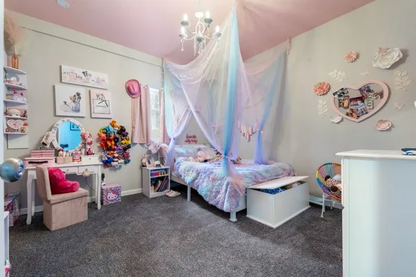 a bed room with a bed and a window