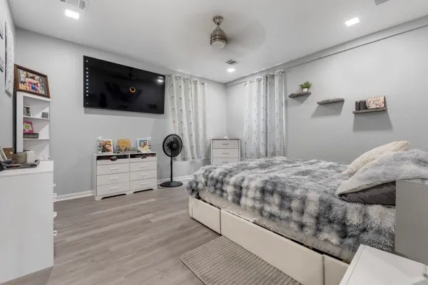 a kitchen with cabinets and a wooden floor