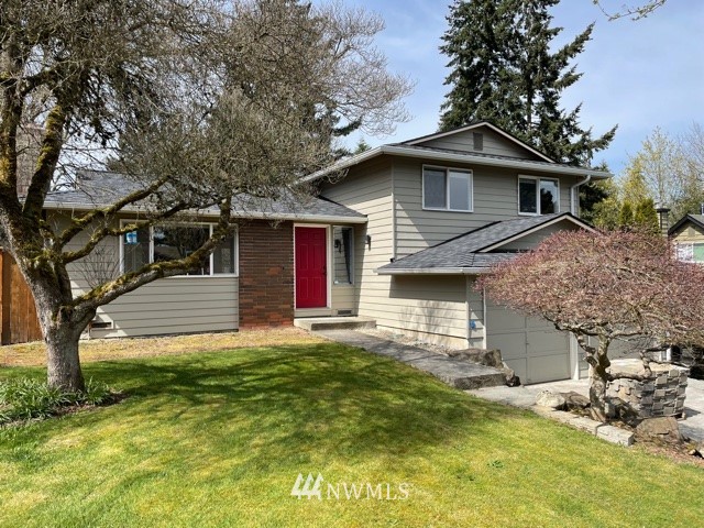 22020 5th Avenue West Bothell, WA 98021 - Photo 1 of 12 a front view of a house with a garden and trees