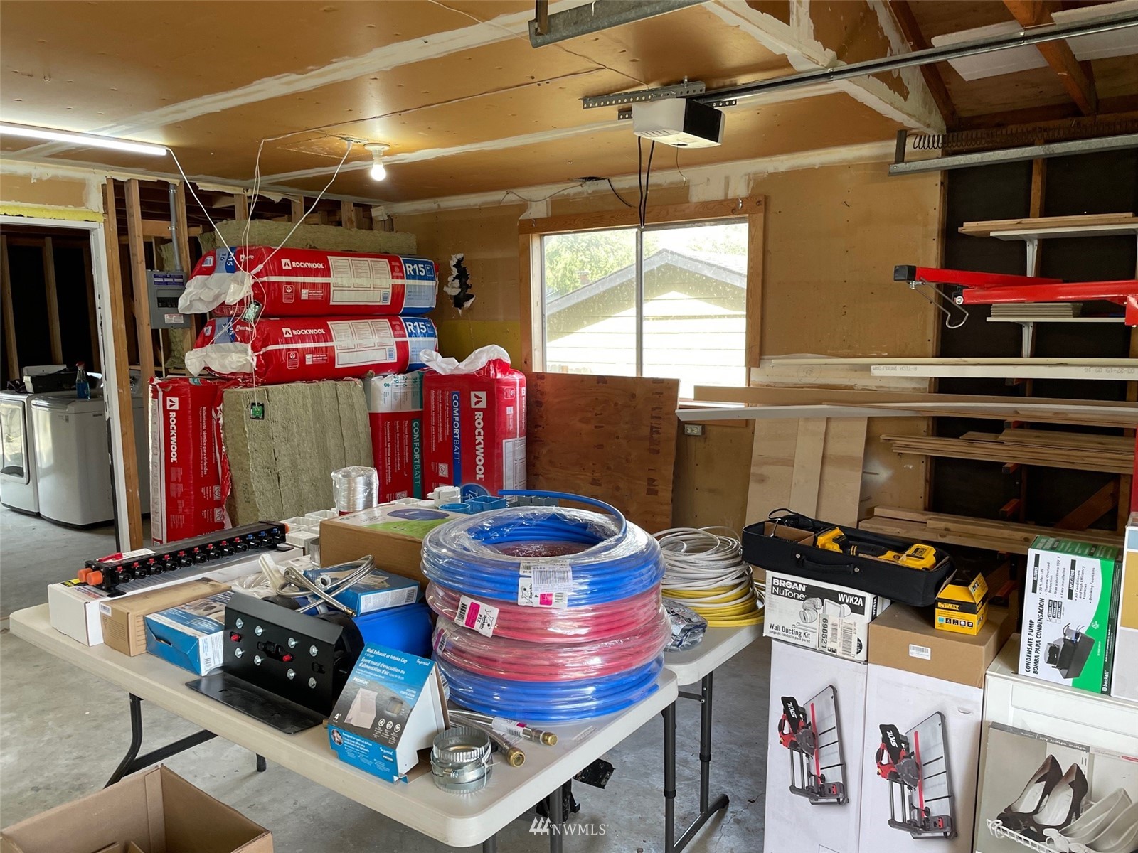 22020 5th Avenue West Bothell, WA 98021 - Photo 9 of 12 a room with lots of different colored cloths