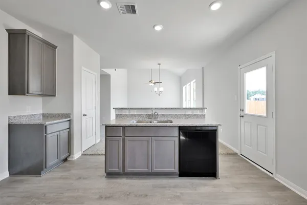 a kitchen with a sink and cabinets