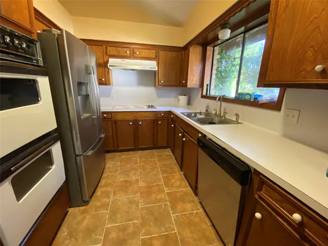 a view of an empty room with a fireplace