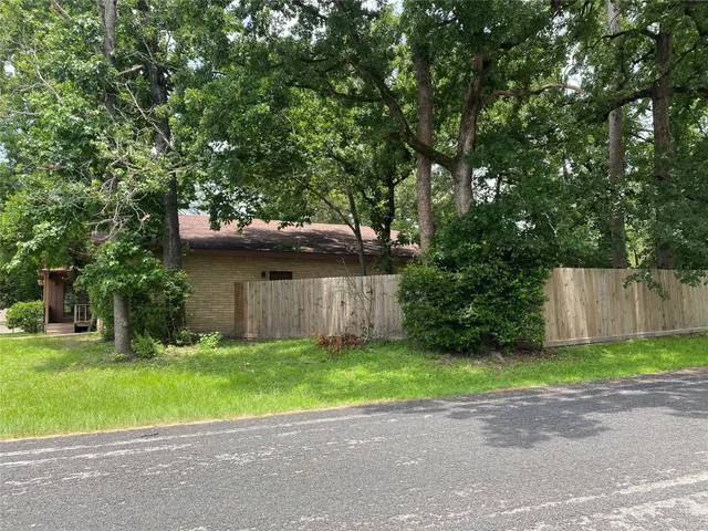a view of outdoor space with deck and tree