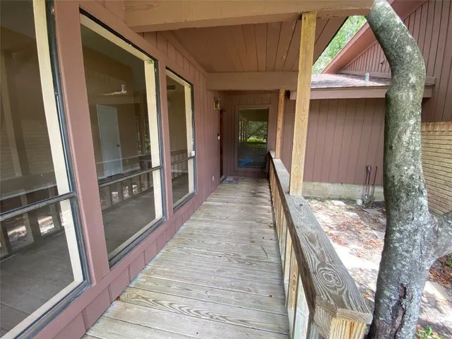 a view of an empty room with windows