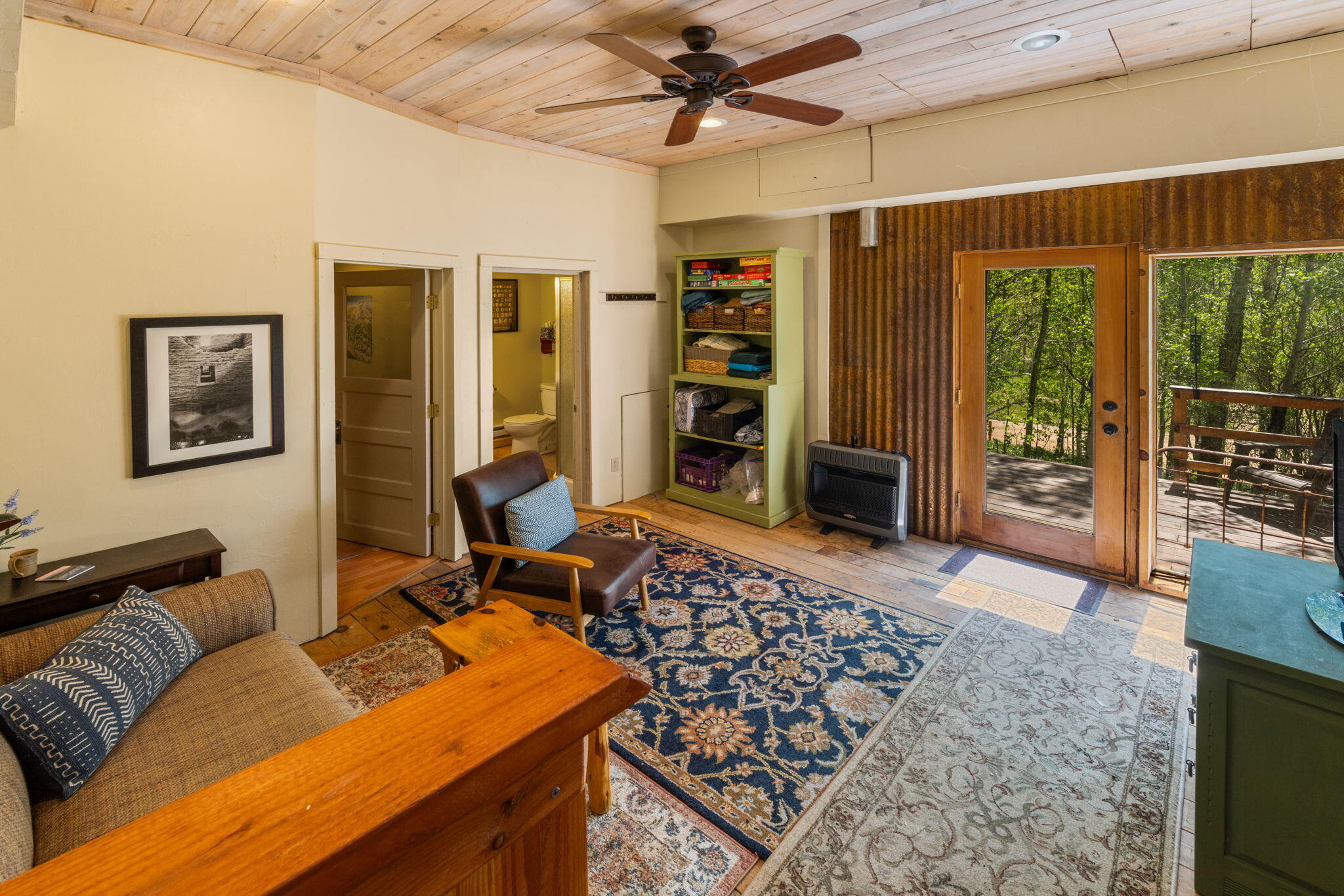 313 North Piedmont Street Rico, CO 81332 - Photo 20 of 43 a living room with furniture a flat screen tv and floor to ceiling window
