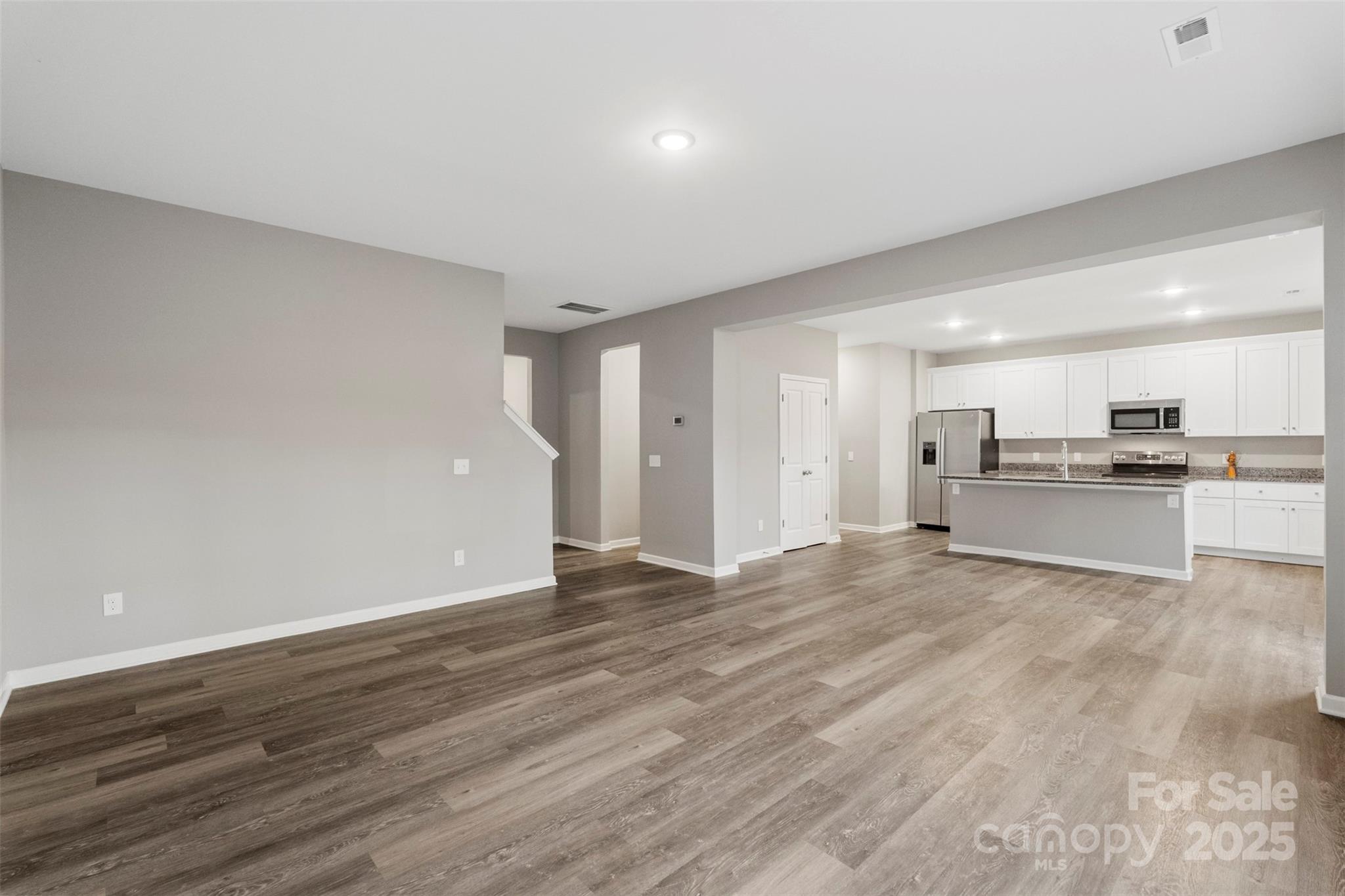 265 Prospect Trail Salisbury, NC 28147 - Photo 15 of 44 a view of a kitchen with a sink and a stove top oven