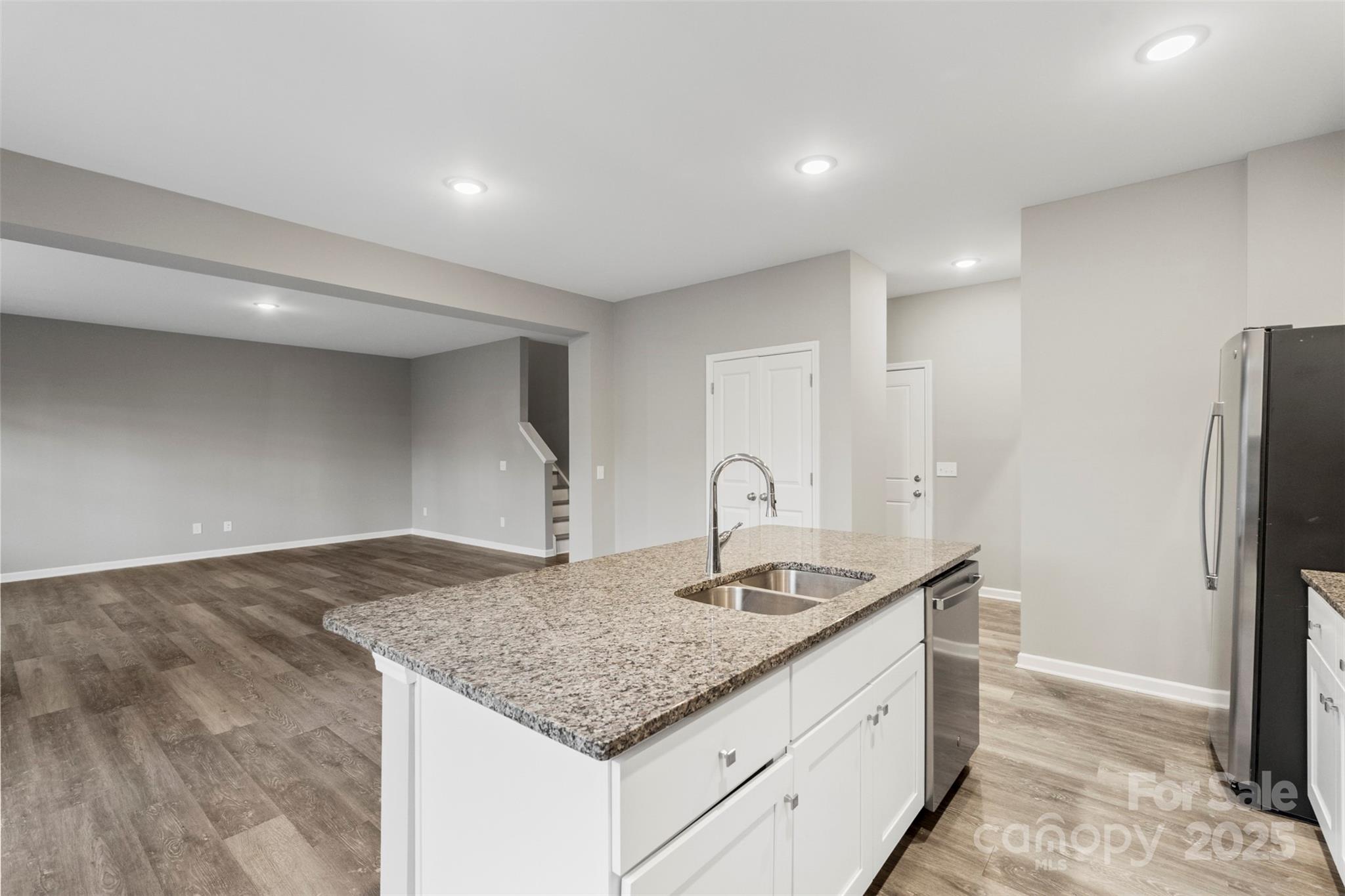 265 Prospect Trail Salisbury, NC 28147 - Photo 20 of 44 a kitchen with stainless steel appliances granite countertop a sink and a refrigerator