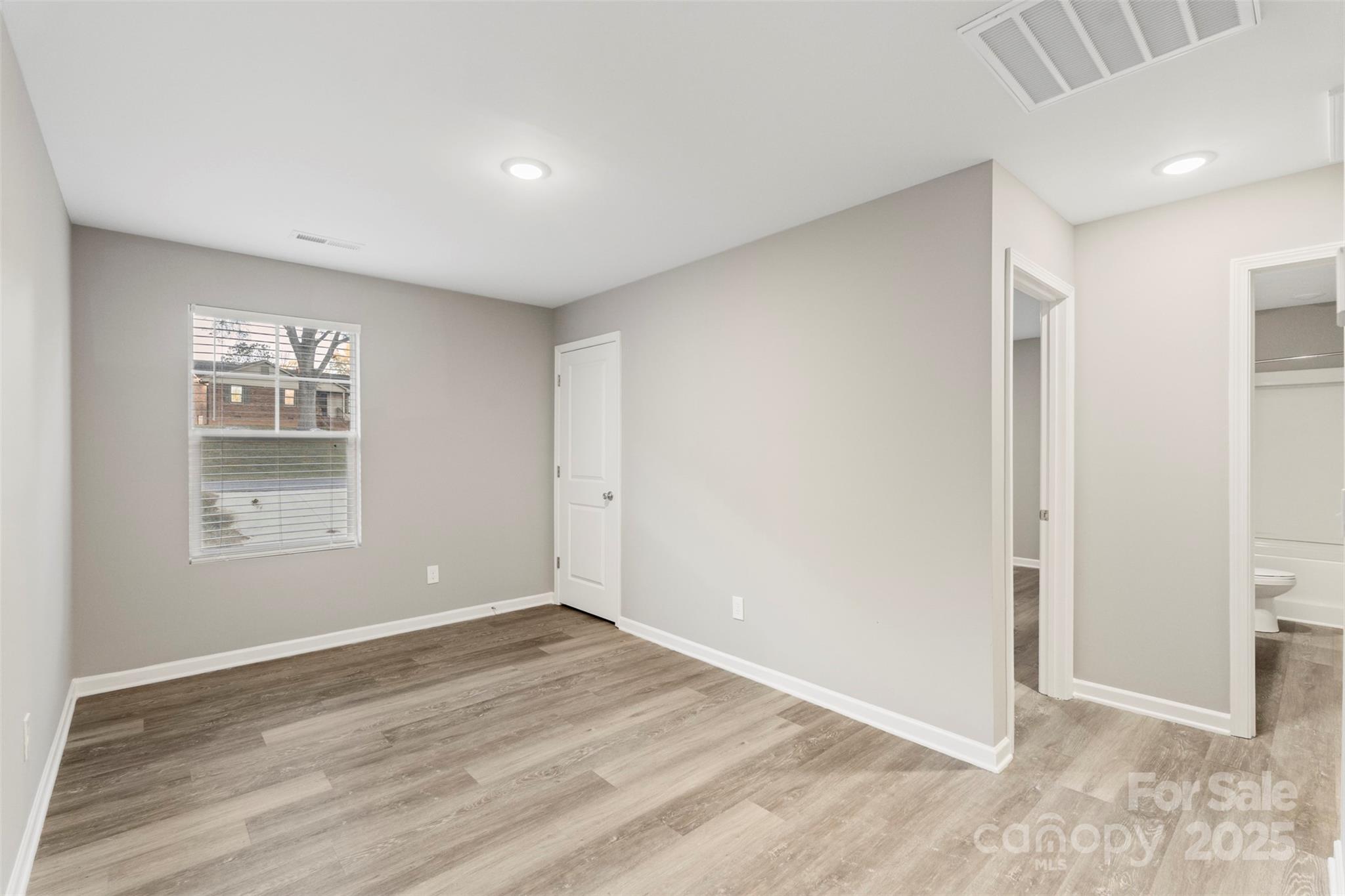 265 Prospect Trail Salisbury, NC 28147 - Photo 22 of 44 a view of empty room with wooden floor and fan