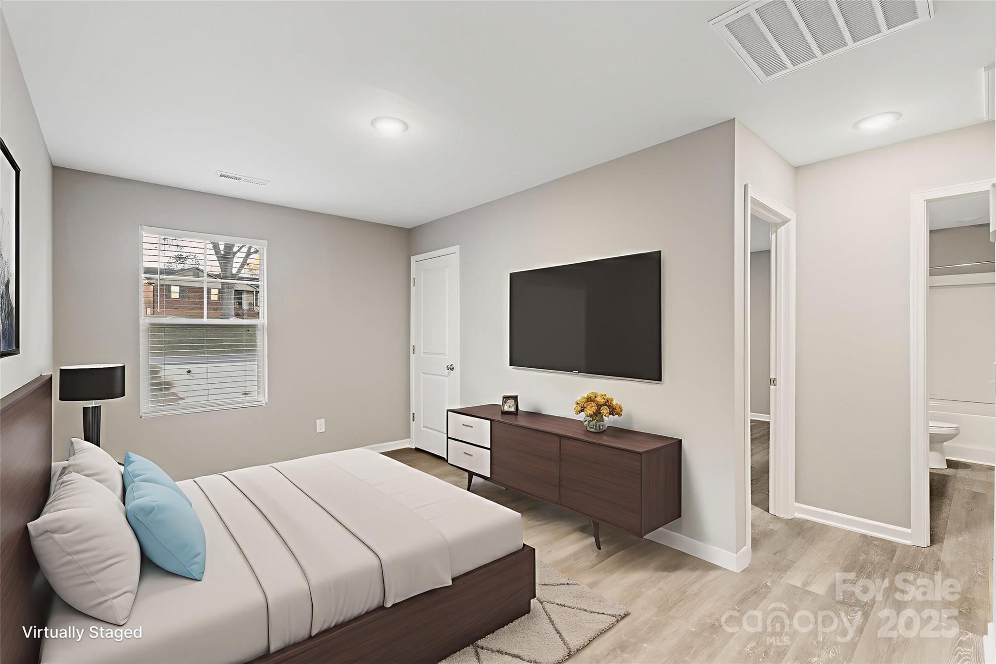 265 Prospect Trail Salisbury, NC 28147 - Photo 23 of 44 a bedroom with a bed and a flat screen tv