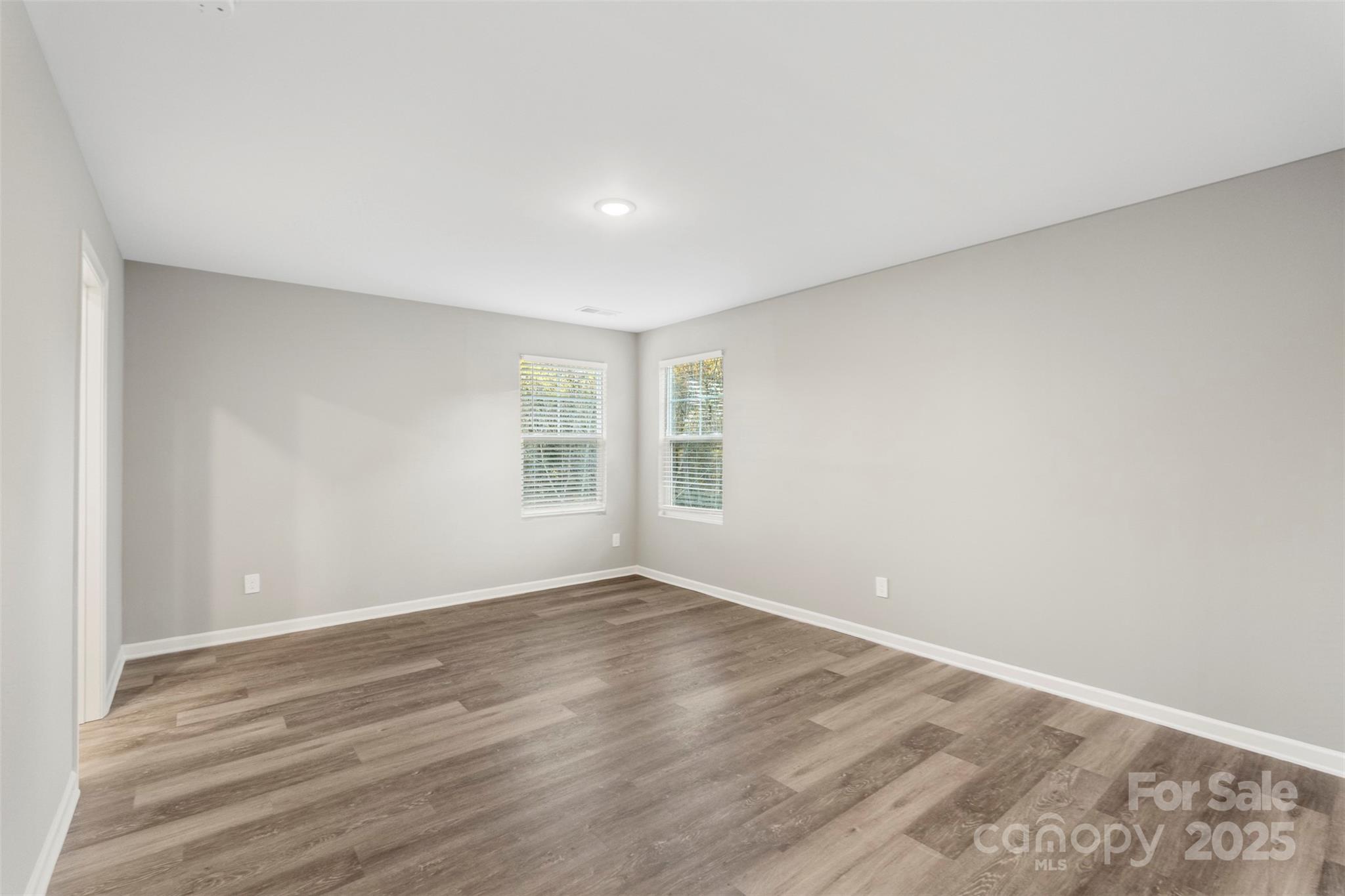 265 Prospect Trail Salisbury, NC 28147 - Photo 25 of 44 a view of an empty room with wooden floor and a window