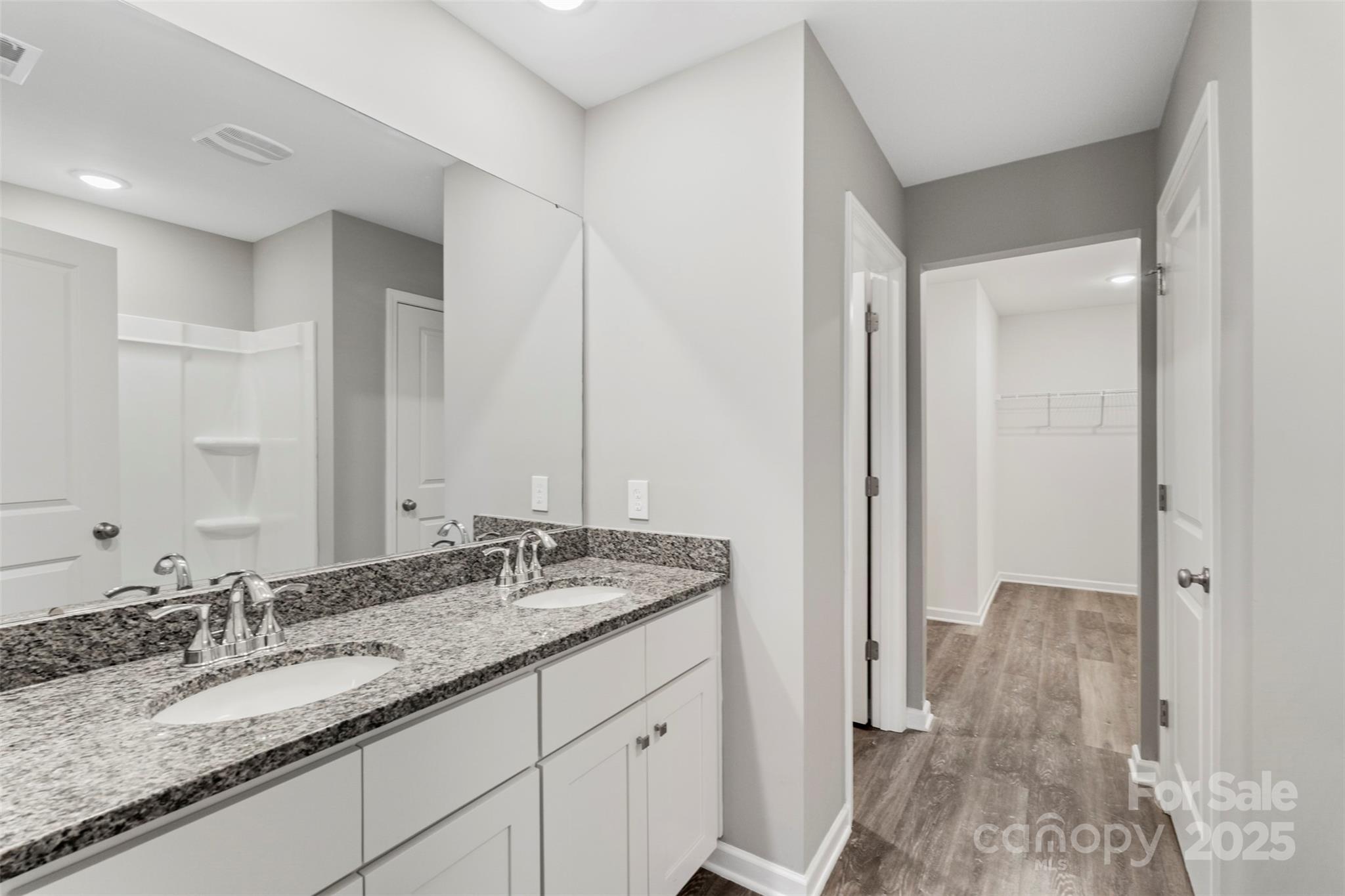265 Prospect Trail Salisbury, NC 28147 - Photo 30 of 44 a bathroom with a granite countertop sink and a mirror