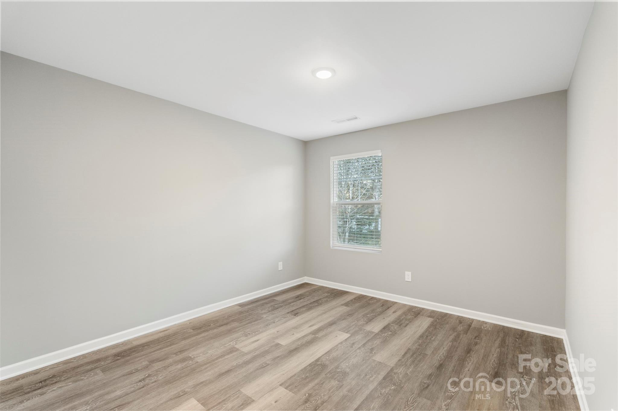 265 Prospect Trail Salisbury, NC 28147 - Photo 35 of 44 an empty room with wooden floor and window