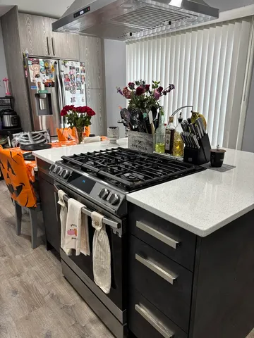 a close view of a stove top oven a sink and dishwasher