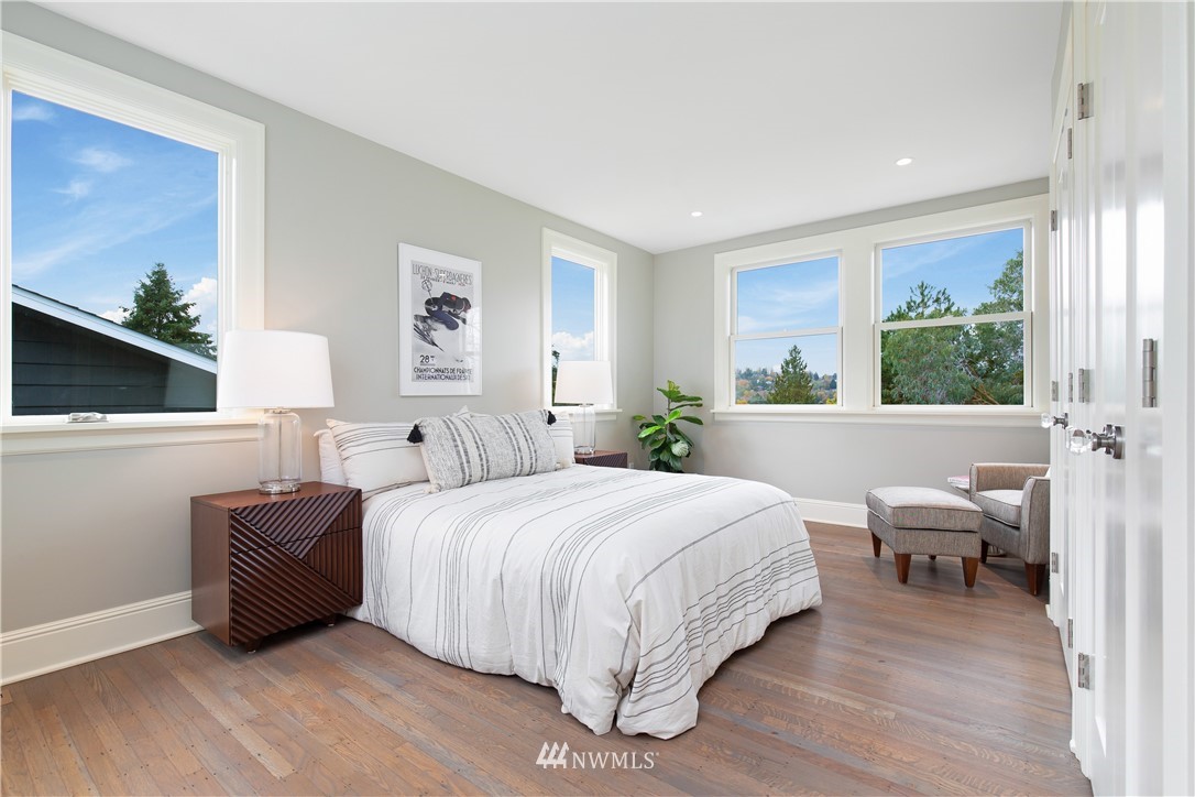 3135 37th Place South Seattle, WA 98144 - Photo 12 of 31 a bedroom with a bed and wooden floor