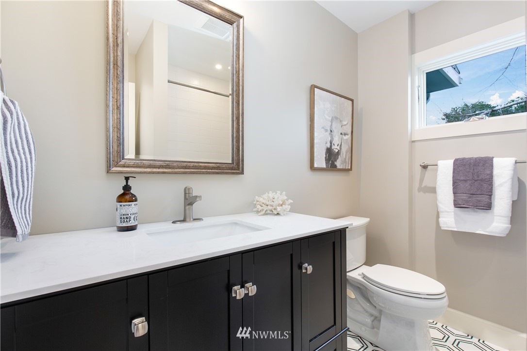 3135 37th Place South Seattle, WA 98144 - Photo 15 of 31 a bathroom with a sink vanity mirror and toilet