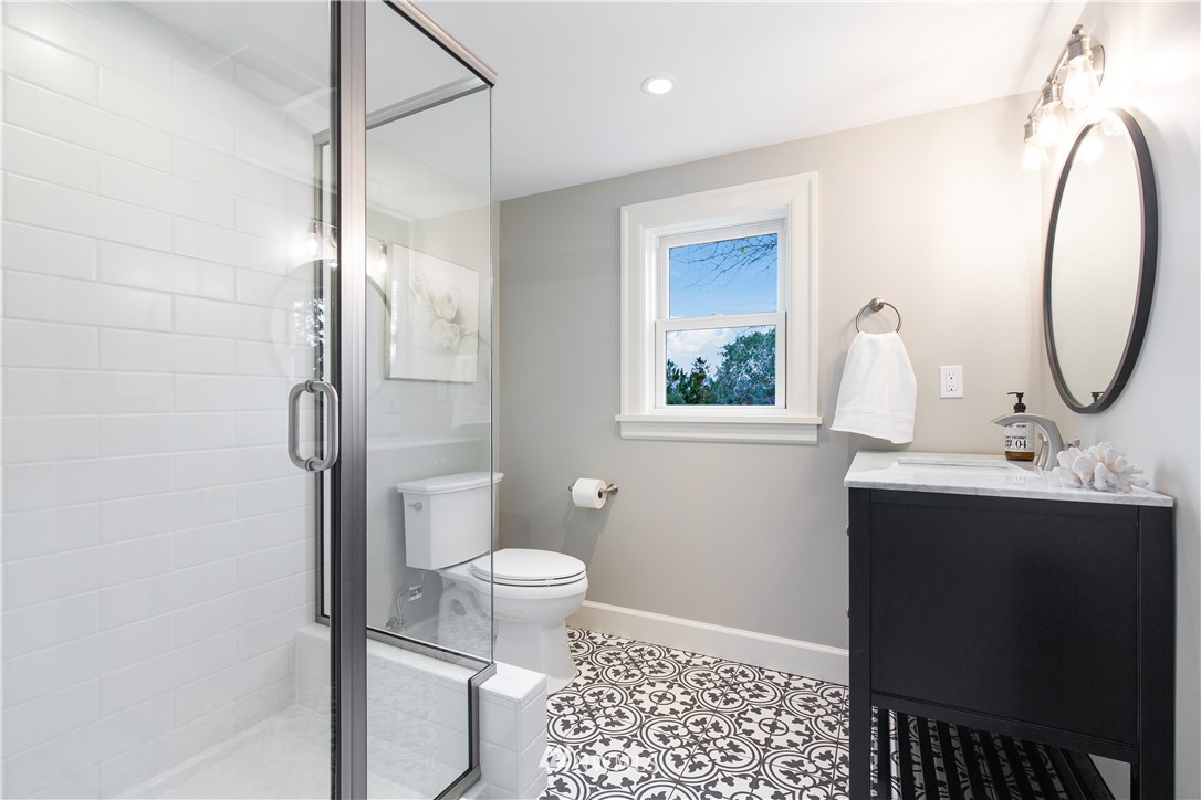 3135 37th Place South Seattle, WA 98144 - Photo 18 of 31 a bathroom with a sink toilet and shower