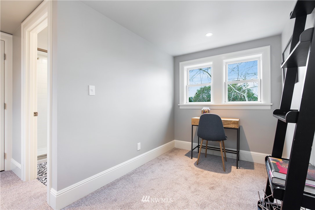 3135 37th Place South Seattle, WA 98144 - Photo 19 of 31 a view of a workspace with furniture and a window