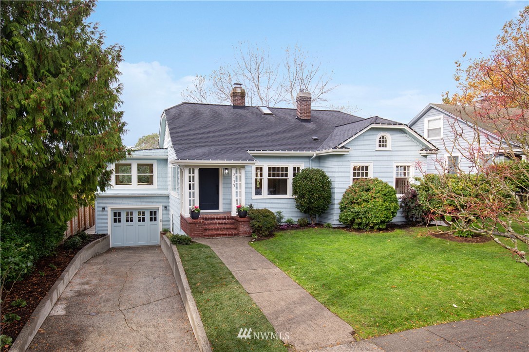 3135 37th Place South Seattle, WA 98144 - Photo 30 of 31 a front view of a house with a garden and yard