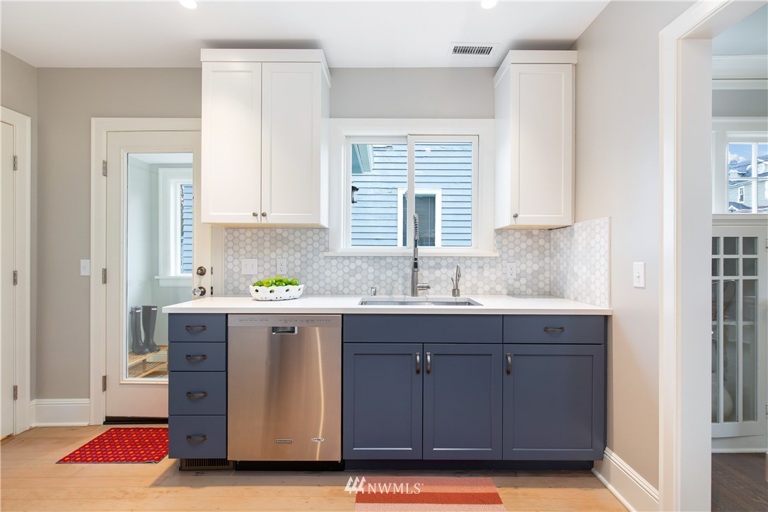 3135 37th Place South Seattle, WA 98144 - Photo 7 of 31 a kitchen with a sink and cabinets