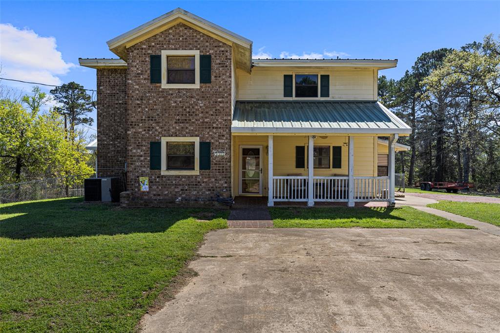 533 Huffman Road Harleton, TX 75651 - Photo 14 of 40 a front view of a house with garden