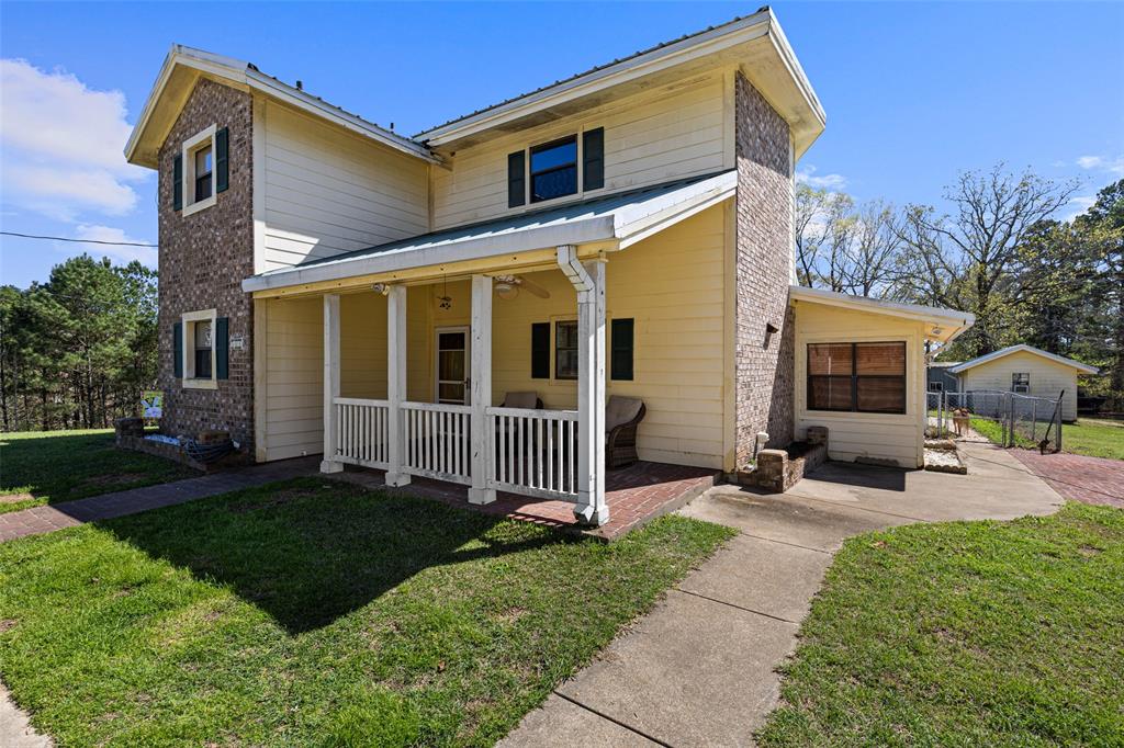 533 Huffman Road Harleton, TX 75651 - Photo 15 of 40 a front view of a house with a yard