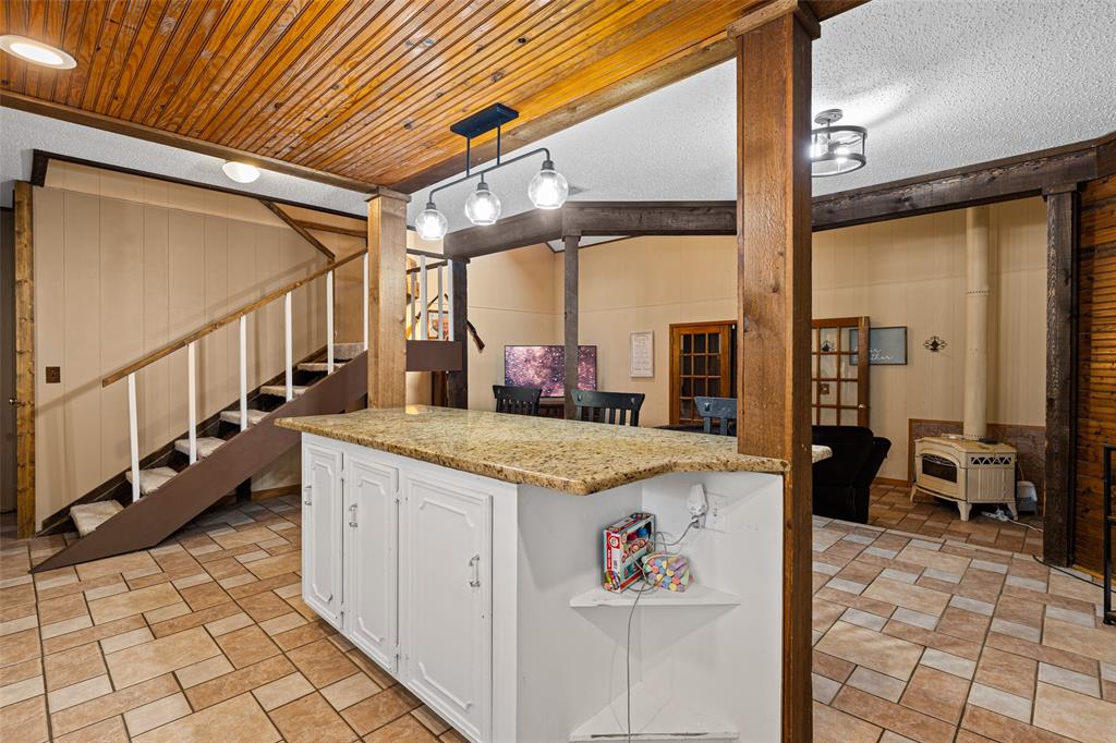 533 Huffman Road Harleton, TX 75651 - Photo 20 of 40 a open kitchen with stainless steel appliances granite countertop a sink stove and cabinets
