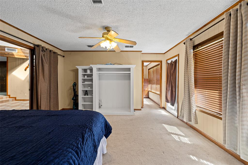 533 Huffman Road Harleton, TX 75651 - Photo 28 of 40 a bedroom with a bed and a large window