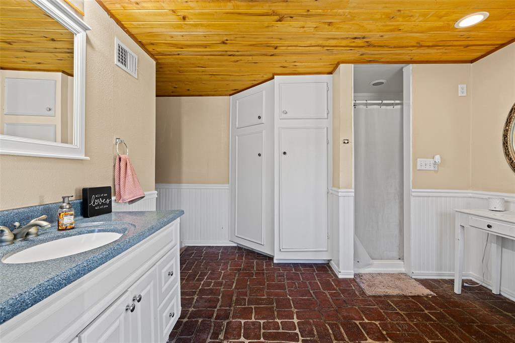 533 Huffman Road Harleton, TX 75651 - Photo 32 of 40 a bathroom with a sink and a mirror
