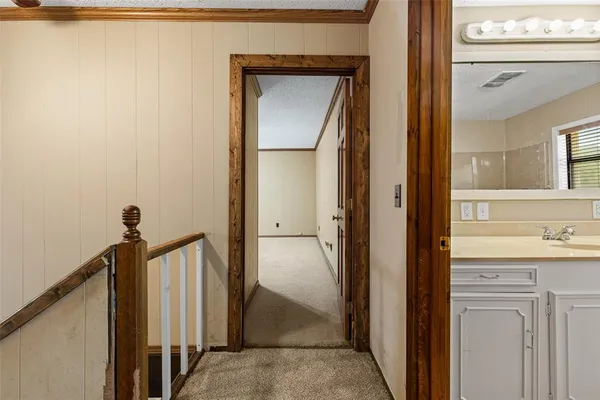 a view of a bathroom from a hallway