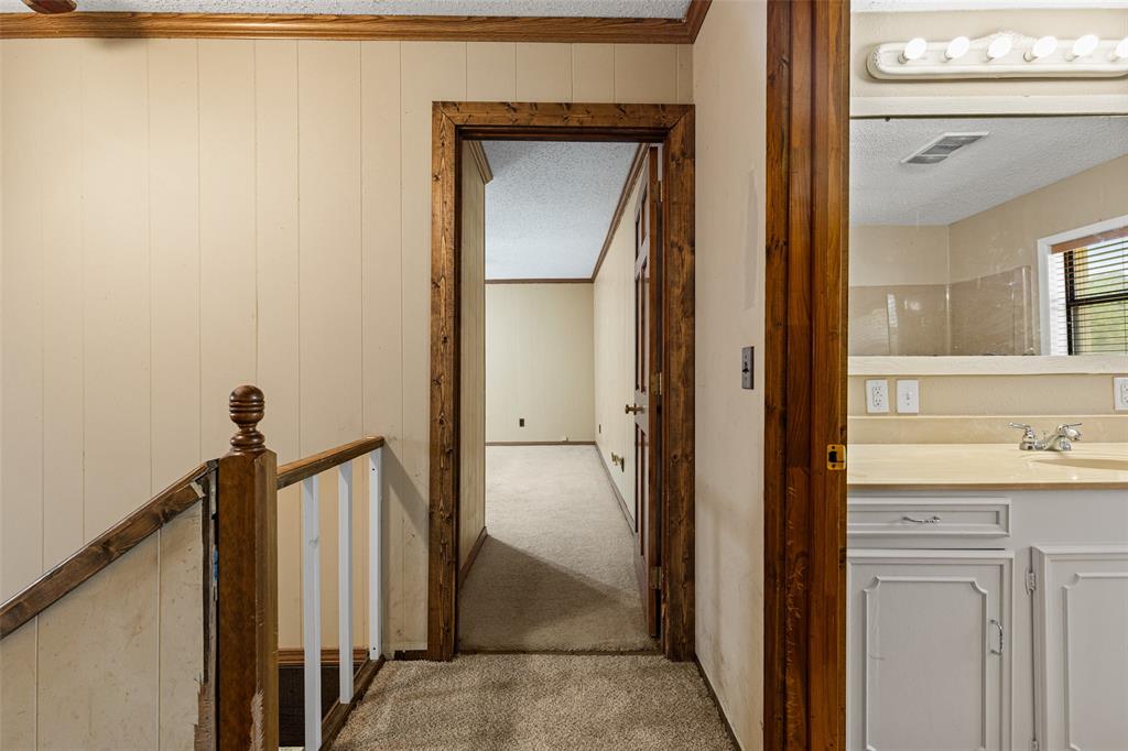 533 Huffman Road Harleton, TX 75651 - Photo 33 of 40 a view of a bathroom from a hallway