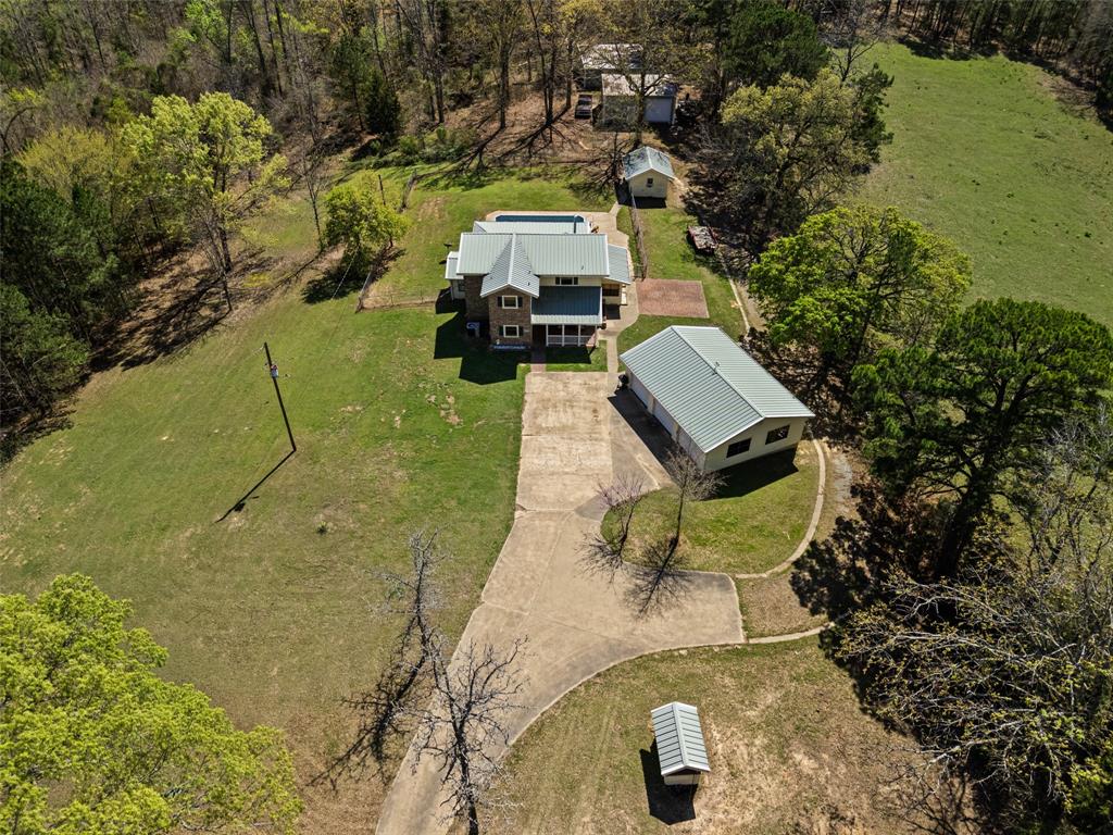 533 Huffman Road Harleton, TX 75651 - Photo 8 of 40 a picture of a yard