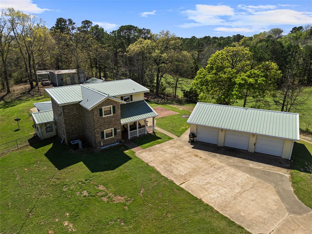 533 Huffman Road Harleton, TX 75651 - Photo 9 of 40 a view of a house with a yard and sitting area