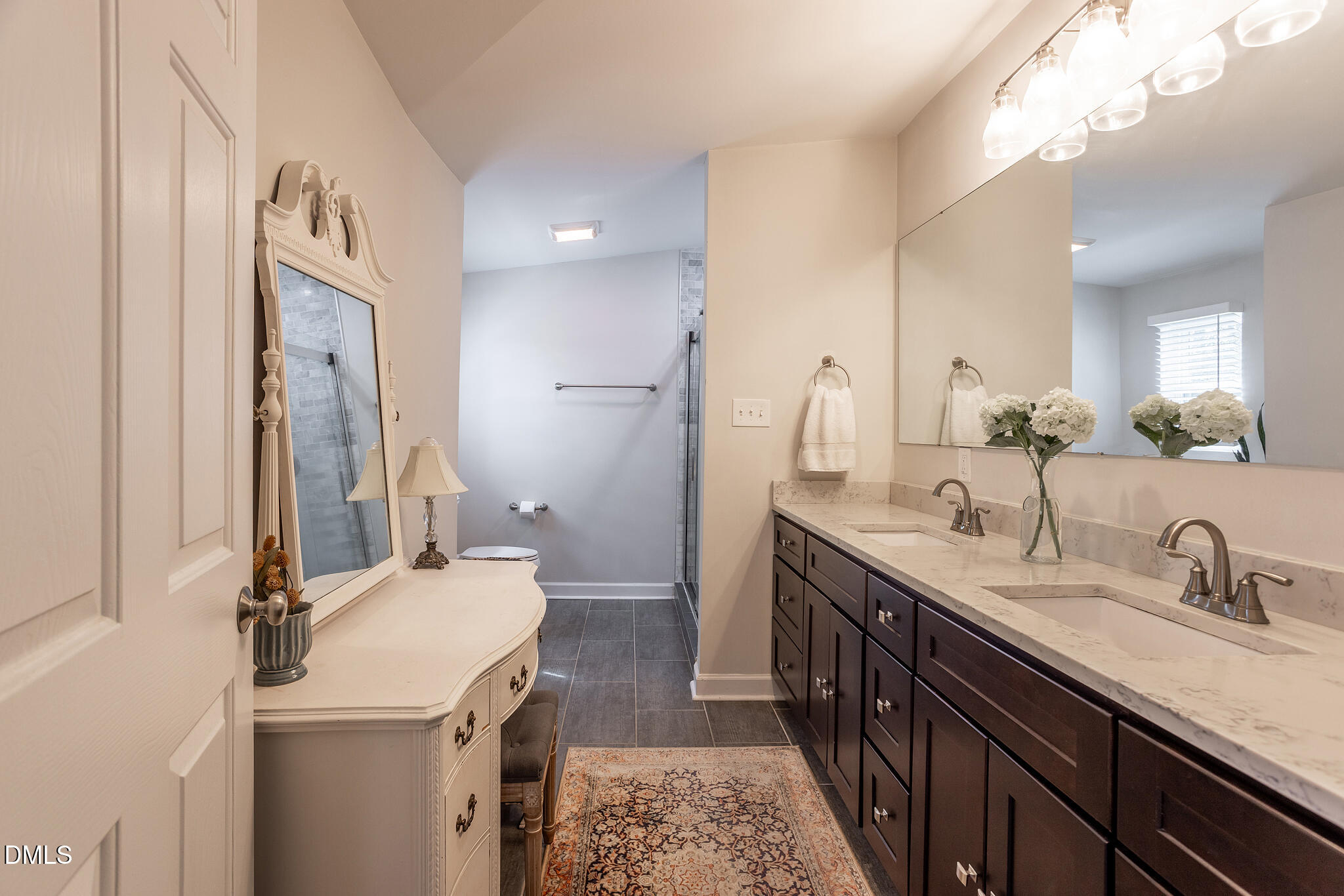 2203 Chapel Hill Road Durham, NC 27707 - Photo 17 of 30 a bathroom with a double vanity sink and a mirror