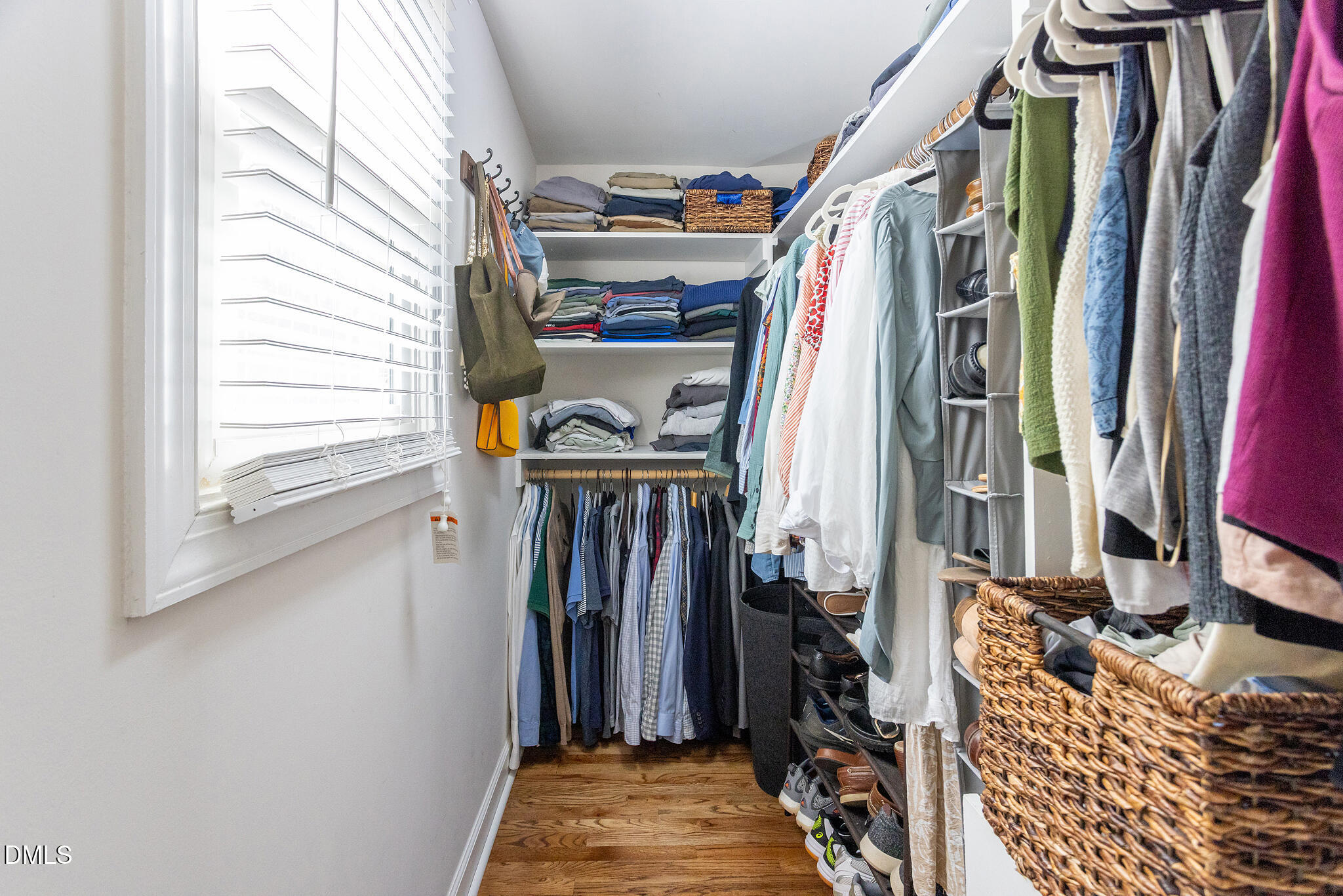 2203 Chapel Hill Road Durham, NC 27707 - Photo 19 of 30 a view of walk in closet with clothes and shoes