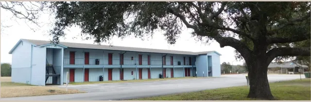 a view of a swimming pool with a garden and lake view