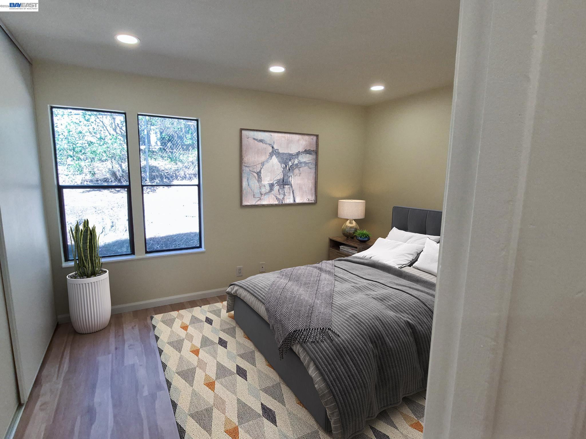 395 Camelback Road, Unit 2 Pleasant Hill, CA 94523 - Photo 2 of 7 a bedroom with a bed and wooden floor