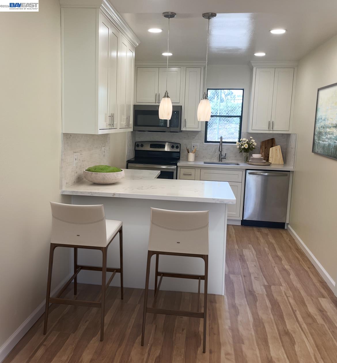 395 Camelback Road, Unit 2 Pleasant Hill, CA 94523 - Photo 3 of 7 a kitchen with kitchen island white cabinets and stainless steel appliances