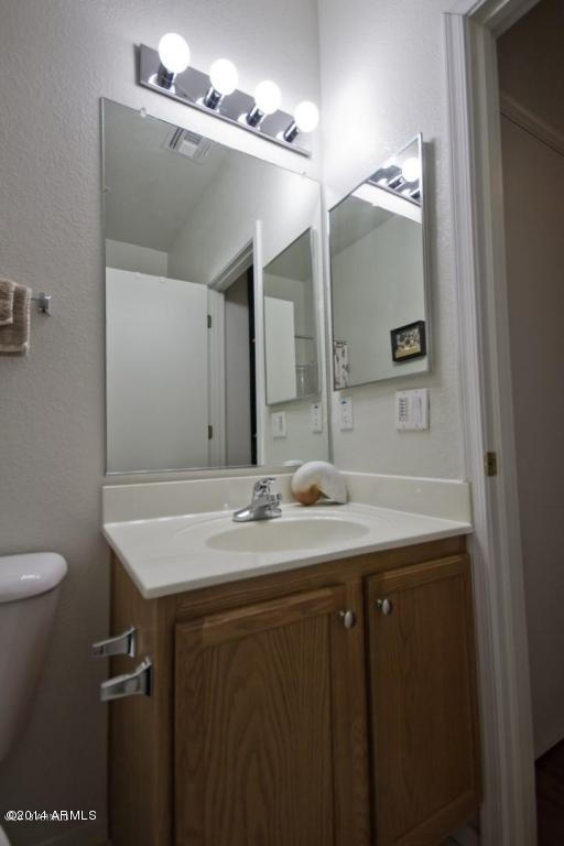 1250 South Rialto, Unit 62 Mesa, AZ 85209 - Photo 22 of 24 a bathroom with a sink and a mirror