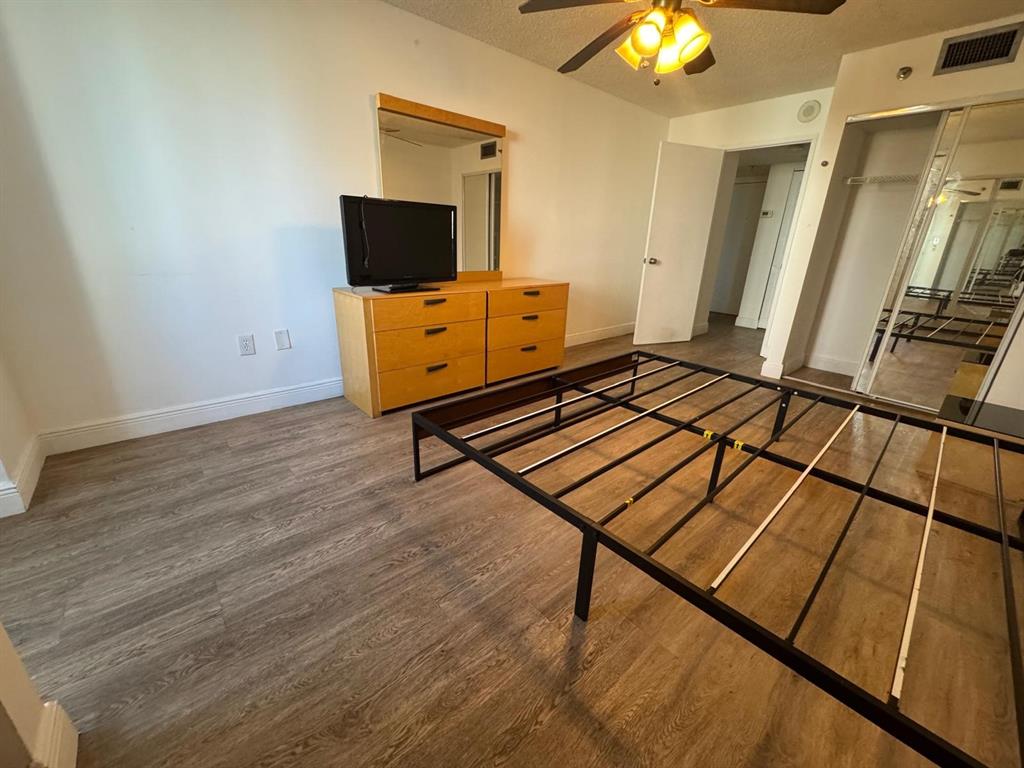 850 North Miami Avenue, Unit W703 Miami, FL 33136 - Photo 14 of 38 a living room with a flat screen tv and a couch