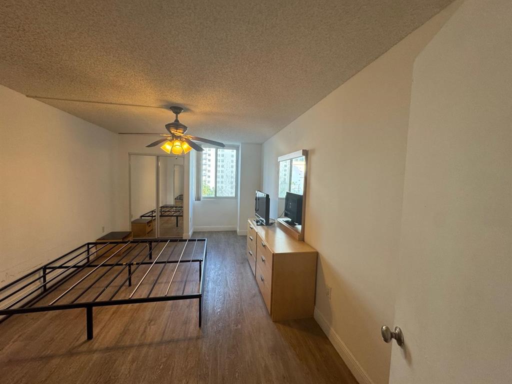 850 North Miami Avenue, Unit W703 Miami, FL 33136 - Photo 16 of 38 a view of a livingroom with wooden floor and staircase